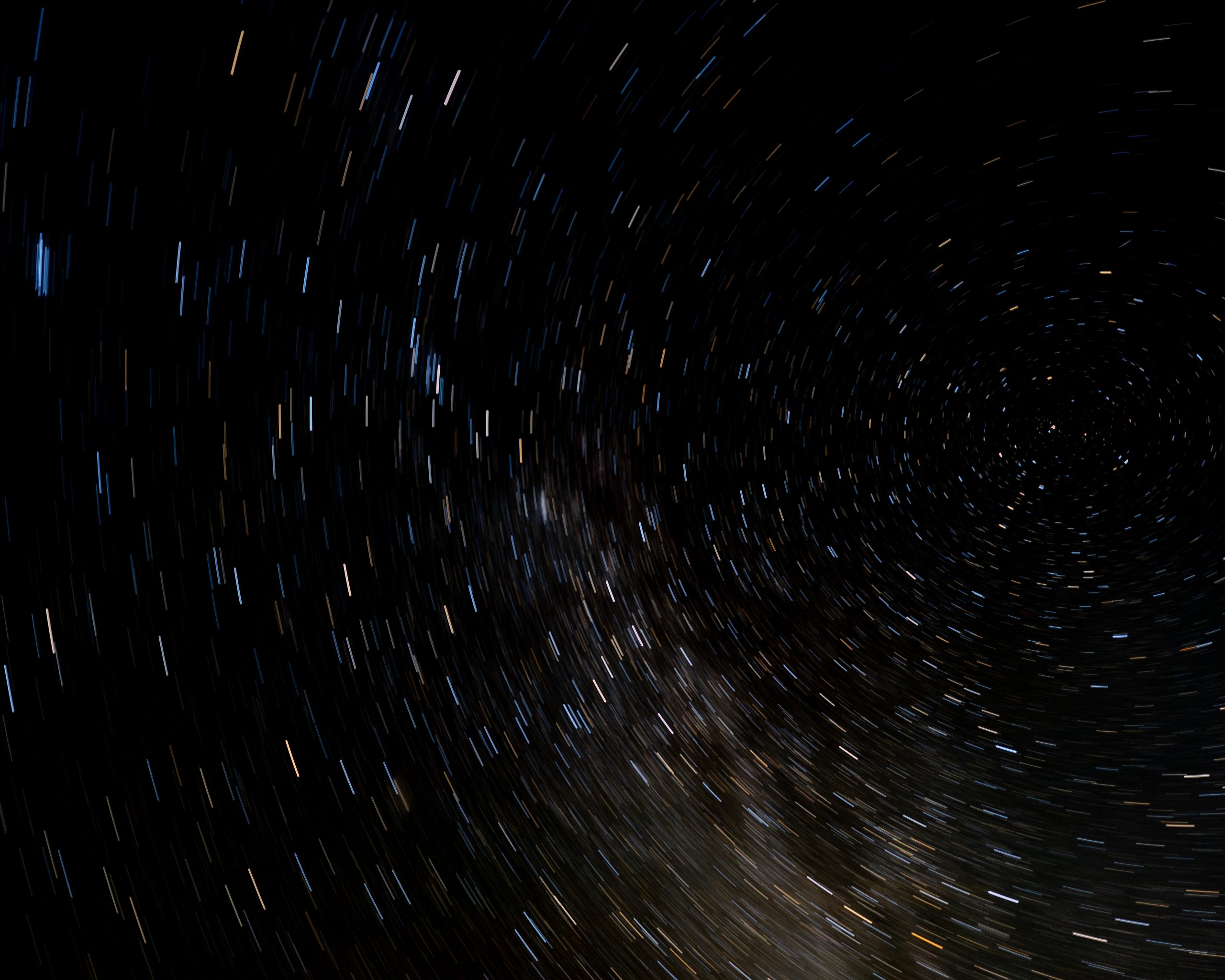 An astronomy photo showing a sky of spinning stars.
